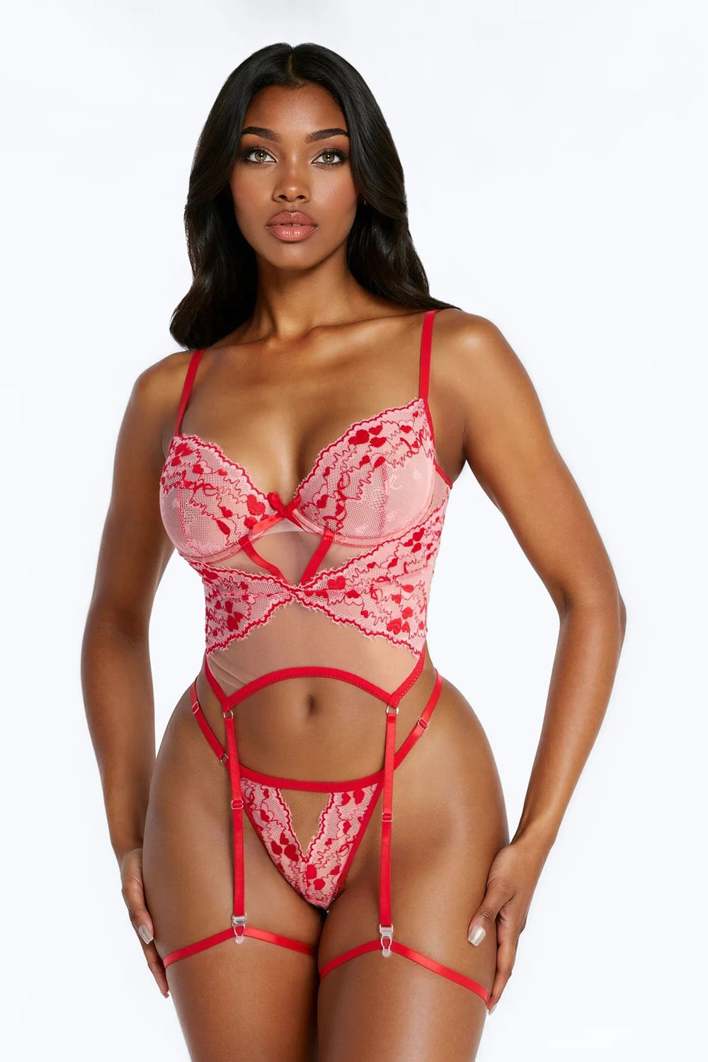 Woman wearing a red lace lingerie set on a white background